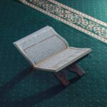 Iman First: Building a Strong Foundation 1 a close up of the Quran on a prayer rug